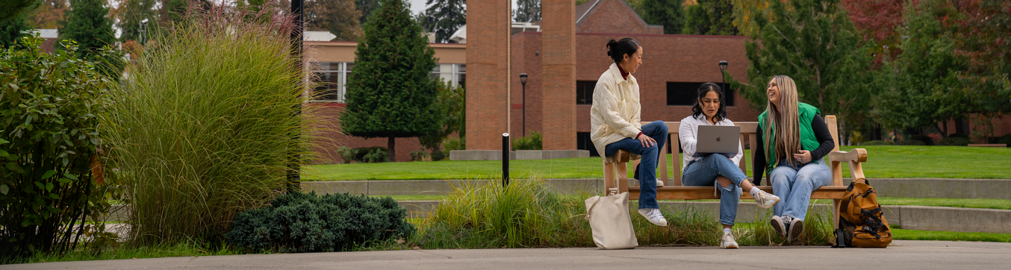 Students sit on the UO Portland campus